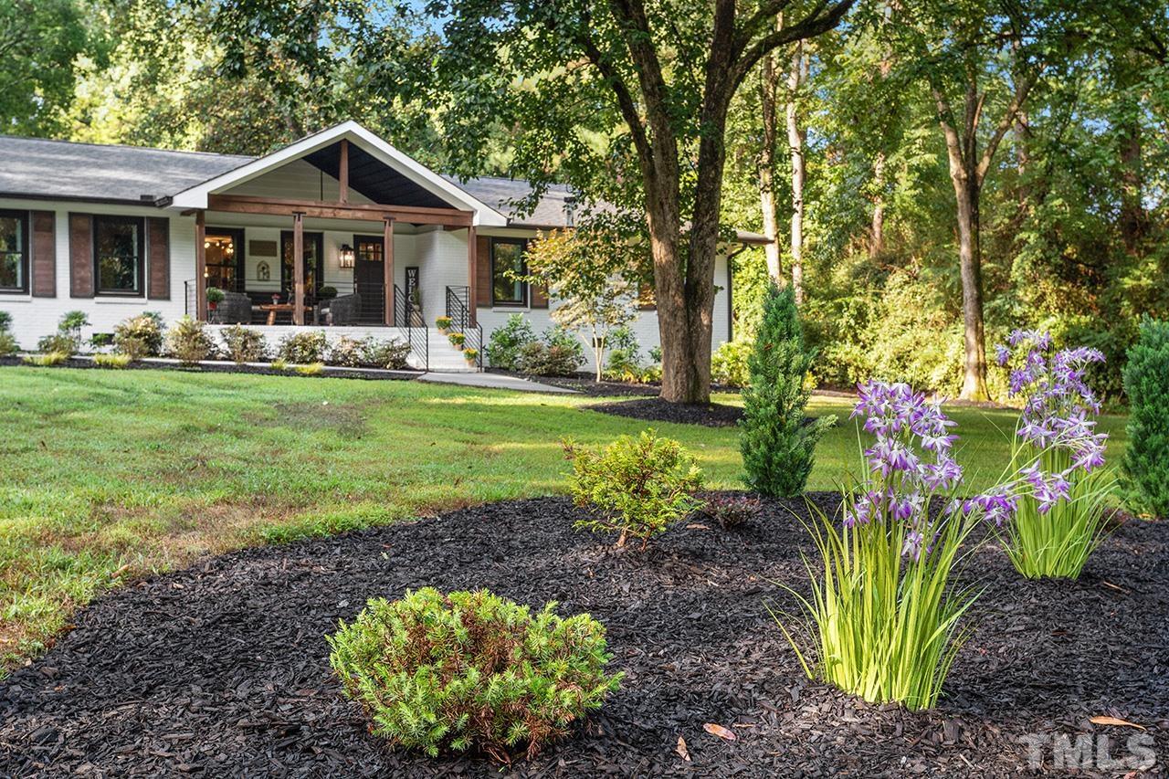 11605 Durant Road Raleigh, NC 27614 - Photo 4 of 42 a front view of a house with garden