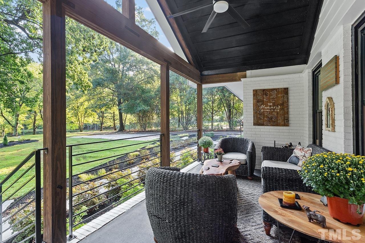 11605 Durant Road Raleigh, NC 27614 - Photo 7 of 42 a balcony with furniture and garden view