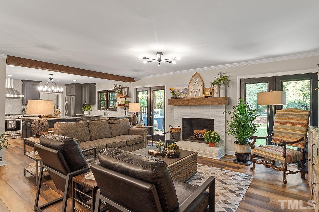 11605 Durant Road Raleigh, NC 27614 - Photo 8 of 42 a living room with furniture and a fireplace