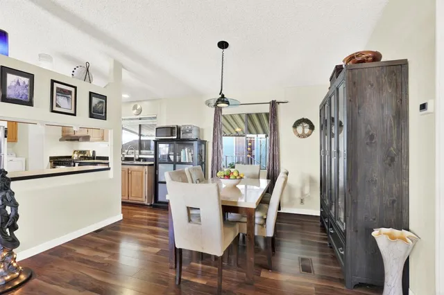 a view of kitchen with furniture and wooden floor