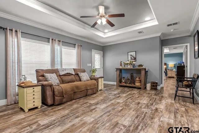 a living room with furniture and a fireplace