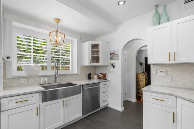 a kitchen with a sink and cabinets