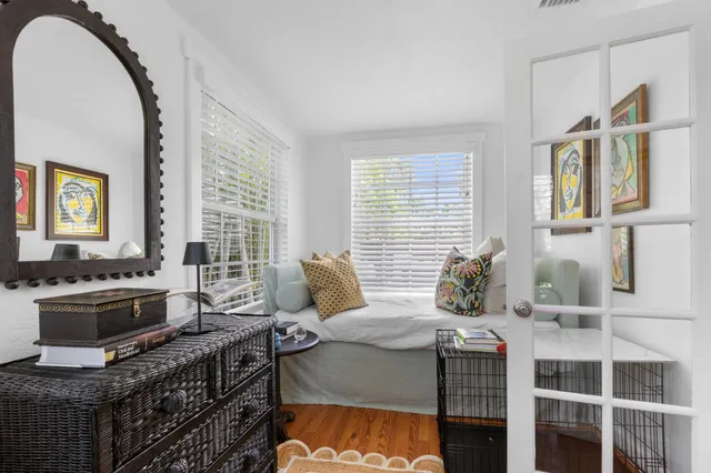 a bedroom with a bed and a stove