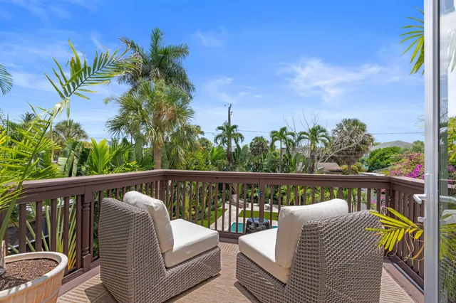 a view of roof deck with furniture