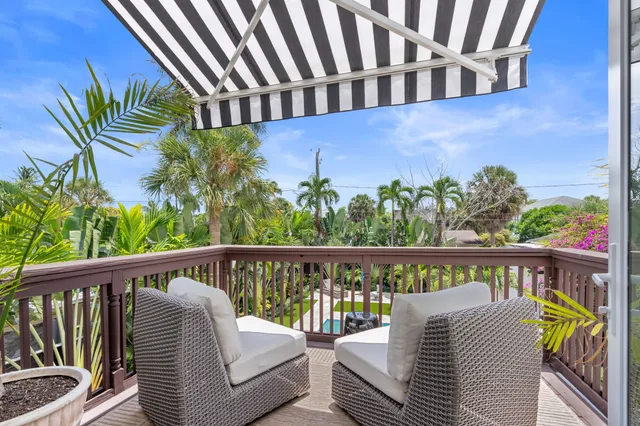 a view of a balcony with wooden floor