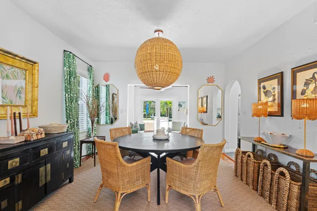 a dining room with furniture and window