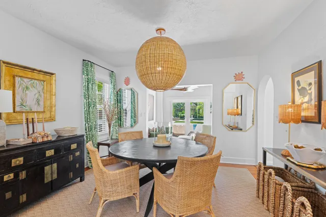 a dining room with furniture and a window