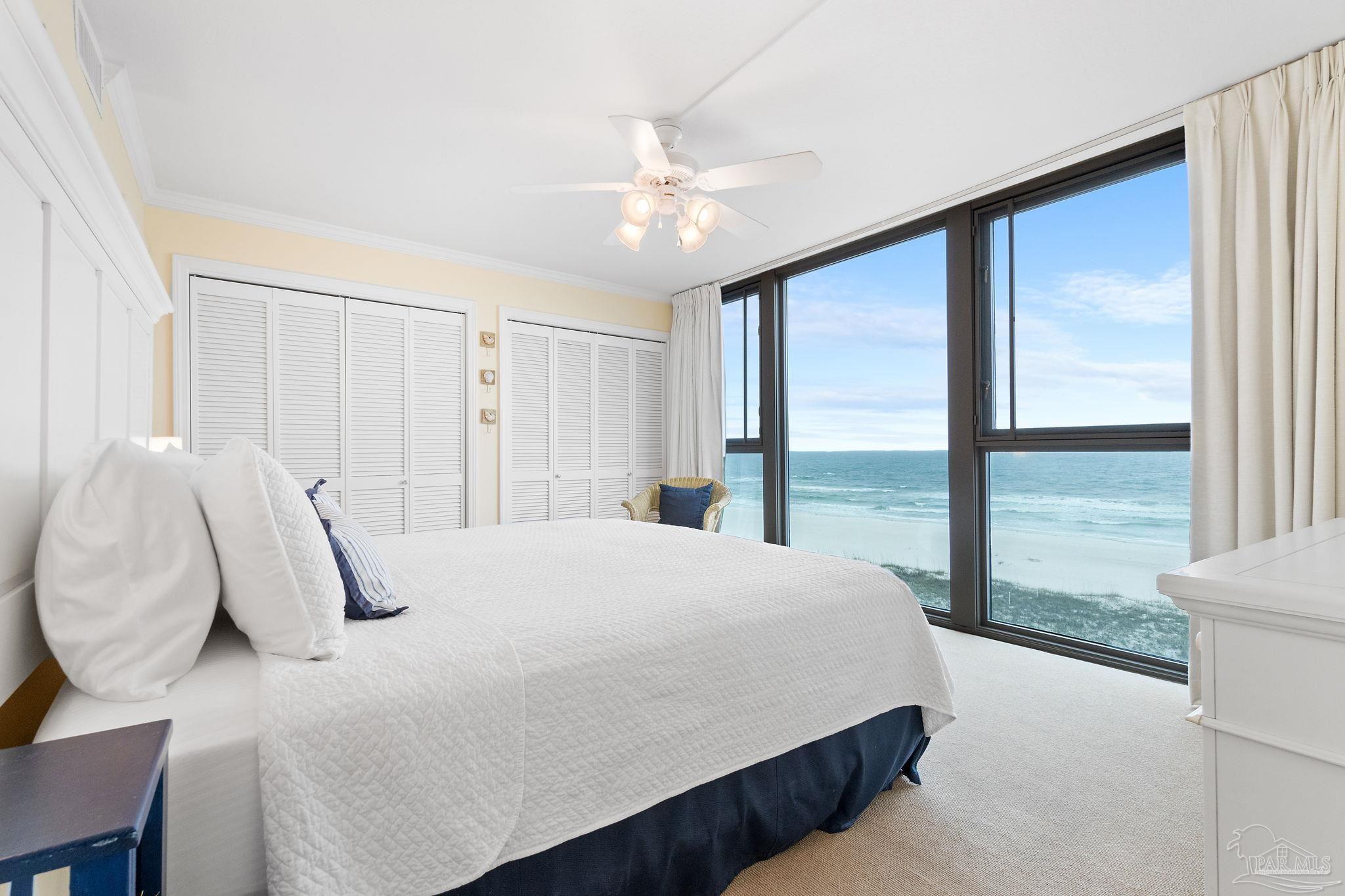 16785 Perdido Key Drive, Unit 503 Perdido Key, FL 32507 - Photo 17 of 38 a bedroom with a large bed and a large window