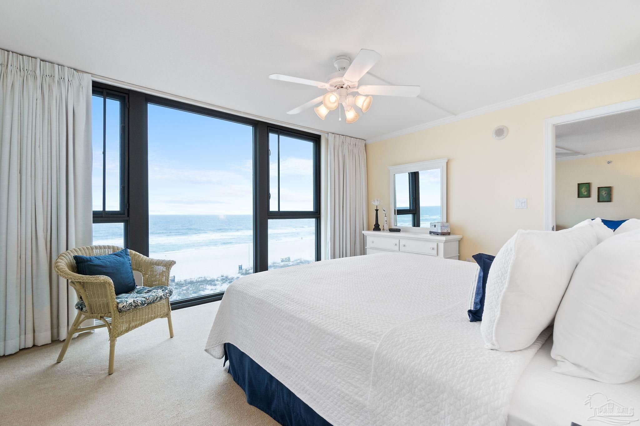 16785 Perdido Key Drive, Unit 503 Perdido Key, FL 32507 - Photo 18 of 38 a bedroom with a bed and large windows