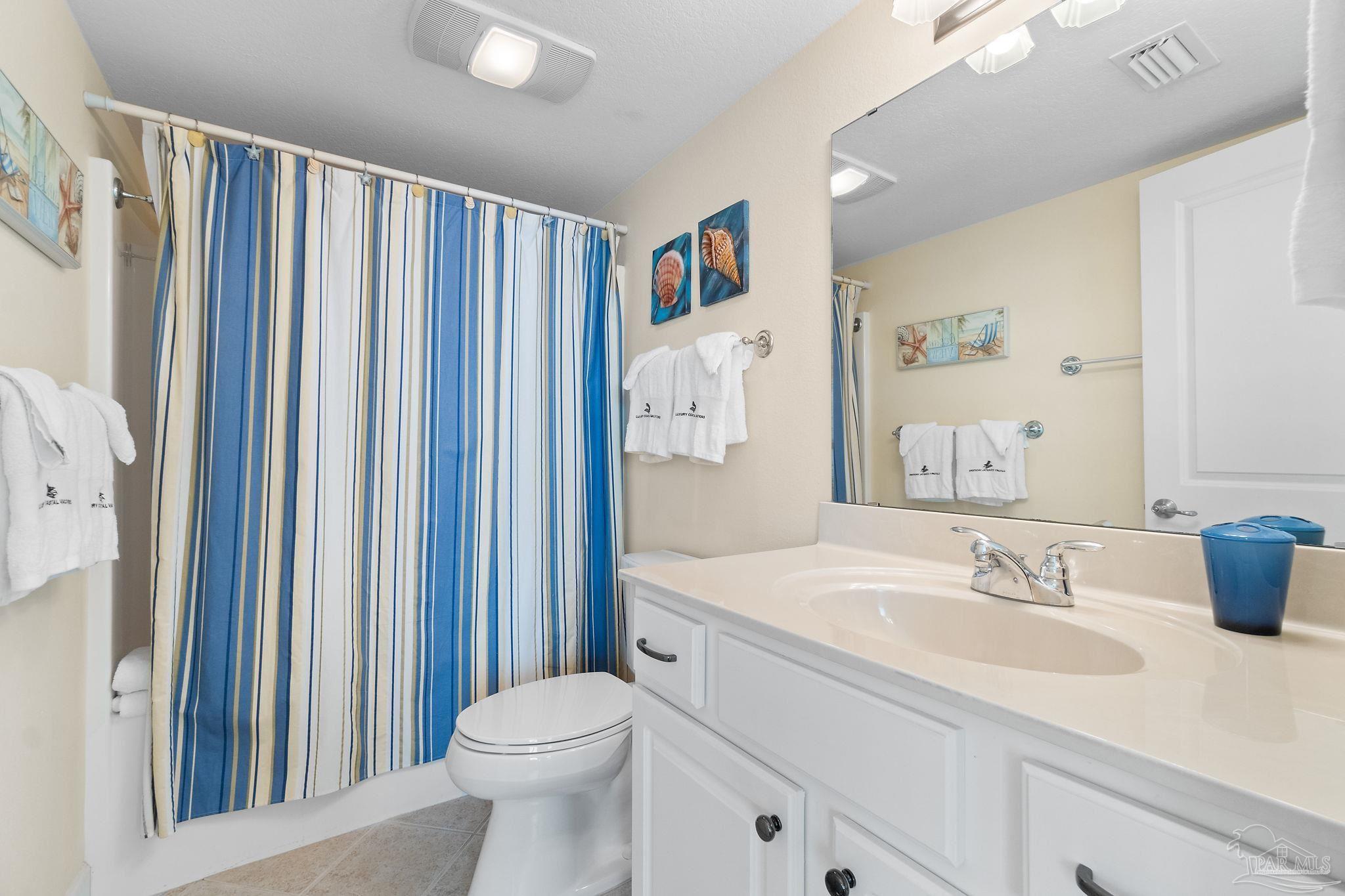 16785 Perdido Key Drive, Unit 503 Perdido Key, FL 32507 - Photo 20 of 38 a bathroom with a sink a toilet and shower