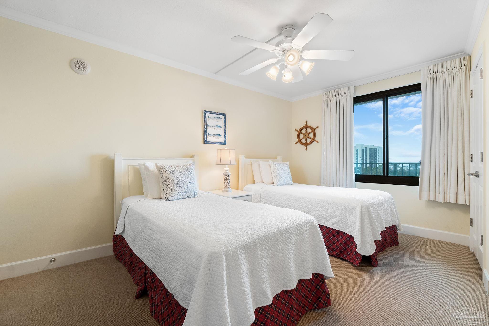 16785 Perdido Key Drive, Unit 503 Perdido Key, FL 32507 - Photo 23 of 38 a bedroom with bed and a chandelier