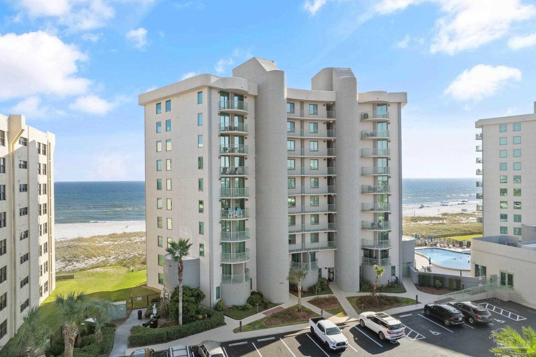 16785 Perdido Key Drive, Unit 503 Perdido Key, FL 32507 - Photo 25 of 38 a front view of a building with glass windows and city view