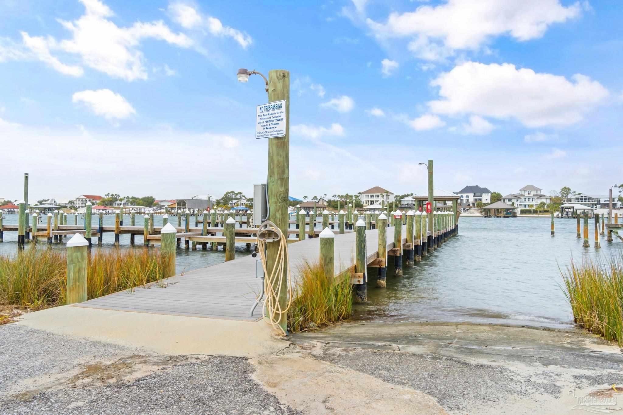 16785 Perdido Key Drive, Unit 503 Perdido Key, FL 32507 - Photo 30 of 38 a view of a lake with boats and trees in the background