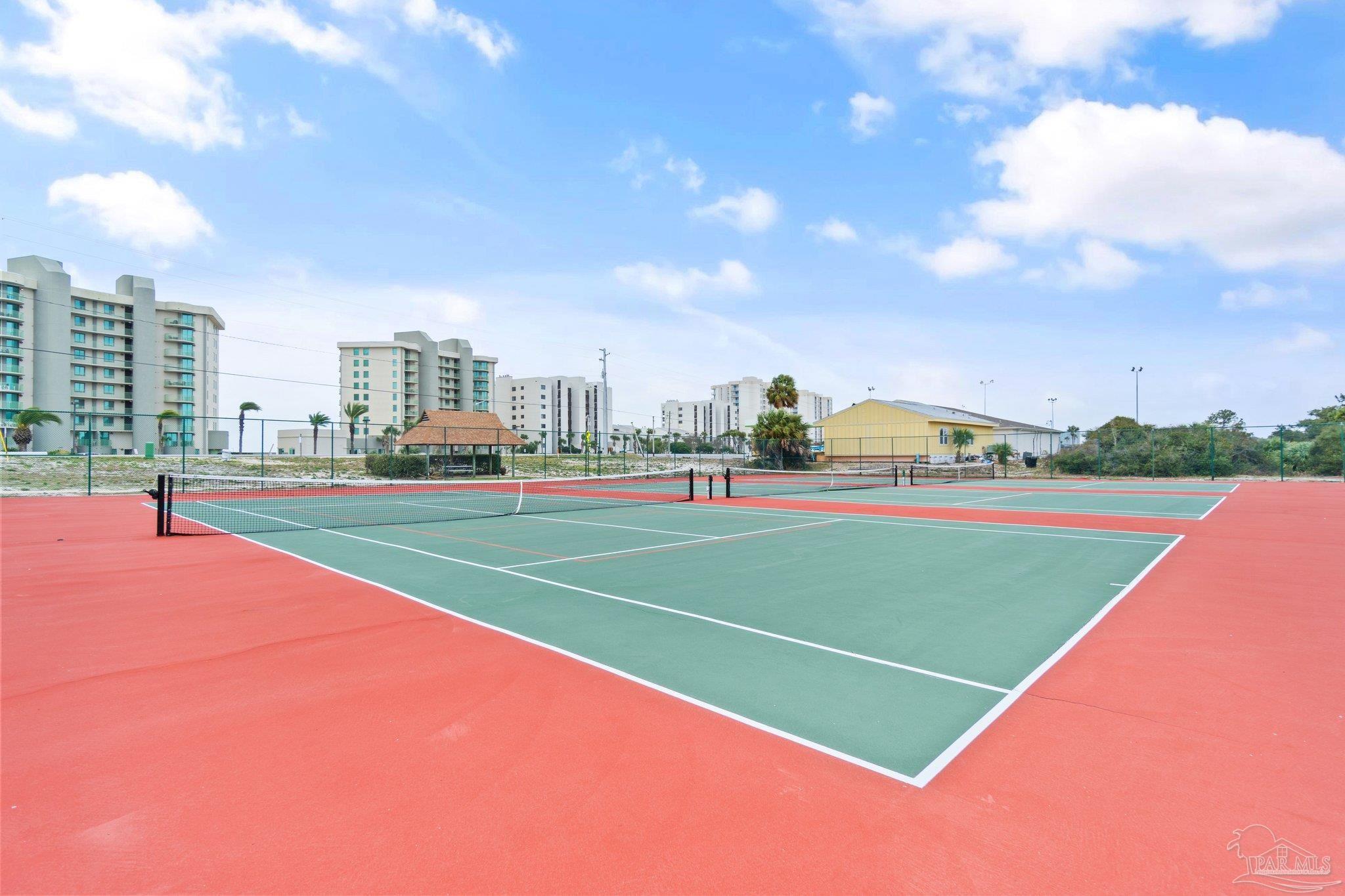 16785 Perdido Key Drive, Unit 503 Perdido Key, FL 32507 - Photo 33 of 38 a view of a tennis ground with large trees