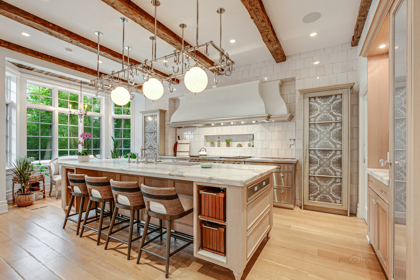 680 South Ridge Road Lake Forest, IL 60045 - Photo 11 of 44 a kitchen that has a lot of cabinets in it and a dining table