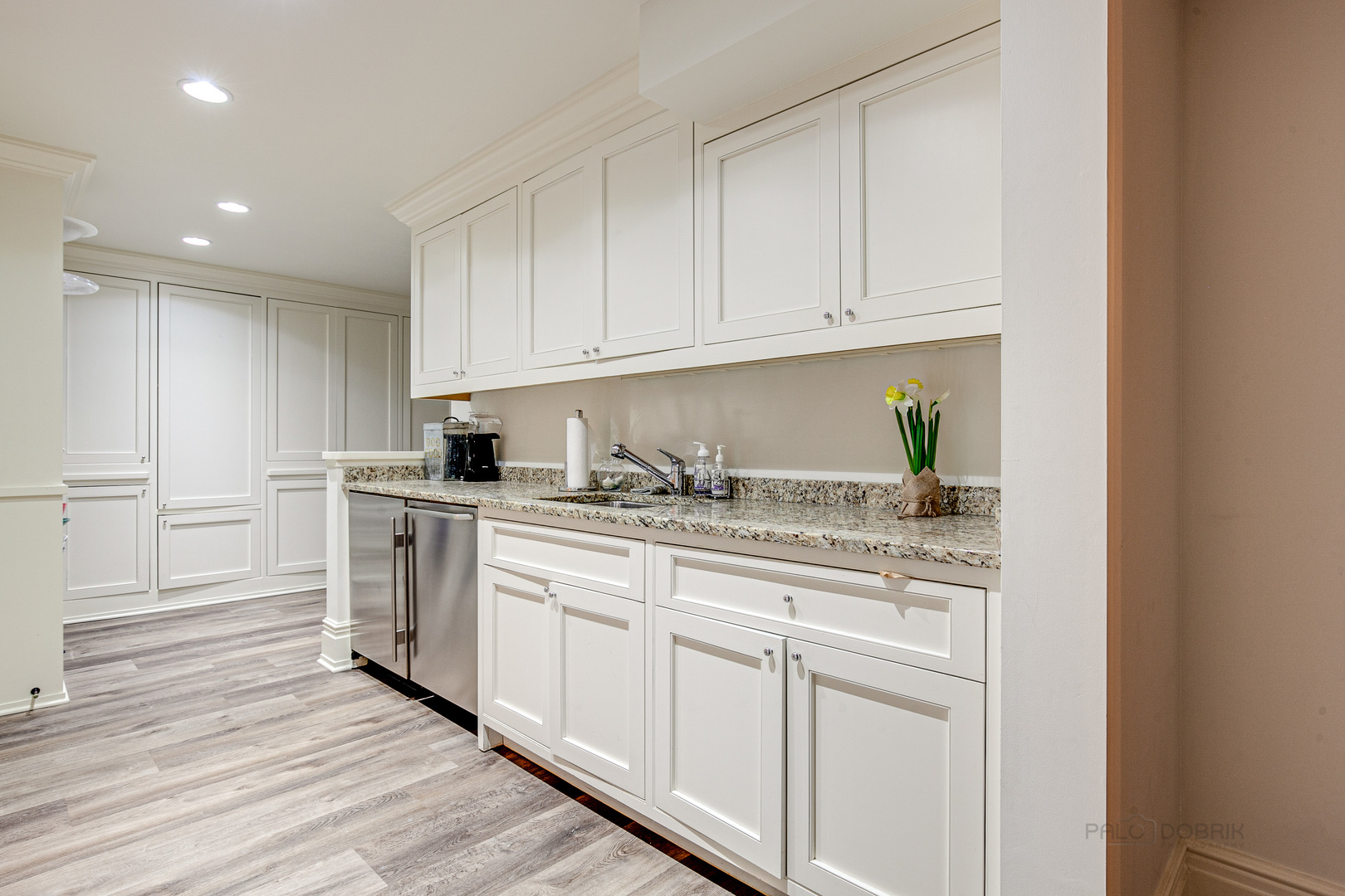 680 South Ridge Road Lake Forest, IL 60045 - Photo 38 of 44 a kitchen with white cabinets and white appliances