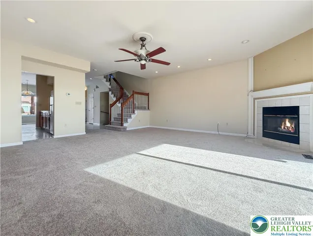 a view of a hallway with furniture