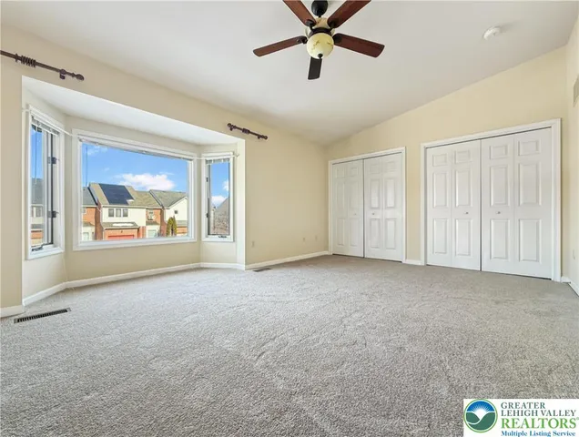 a bathroom with a sink mirror vanity and toilet