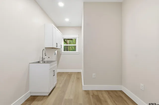 a white toilet sitting next to a bath tub