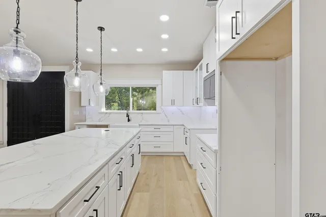a view of house with yard outdoor seating and barbeque oven