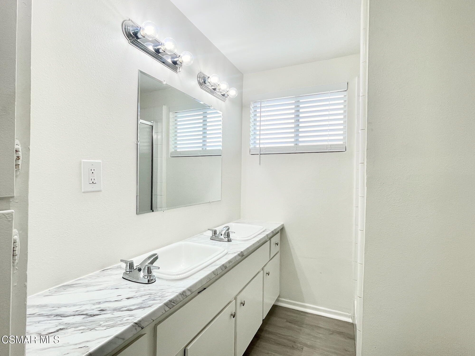 4327 Lou Drive Simi Valley, CA 93063 - Photo 12 of 23 a bathroom with a granite countertop sink and a mirror
