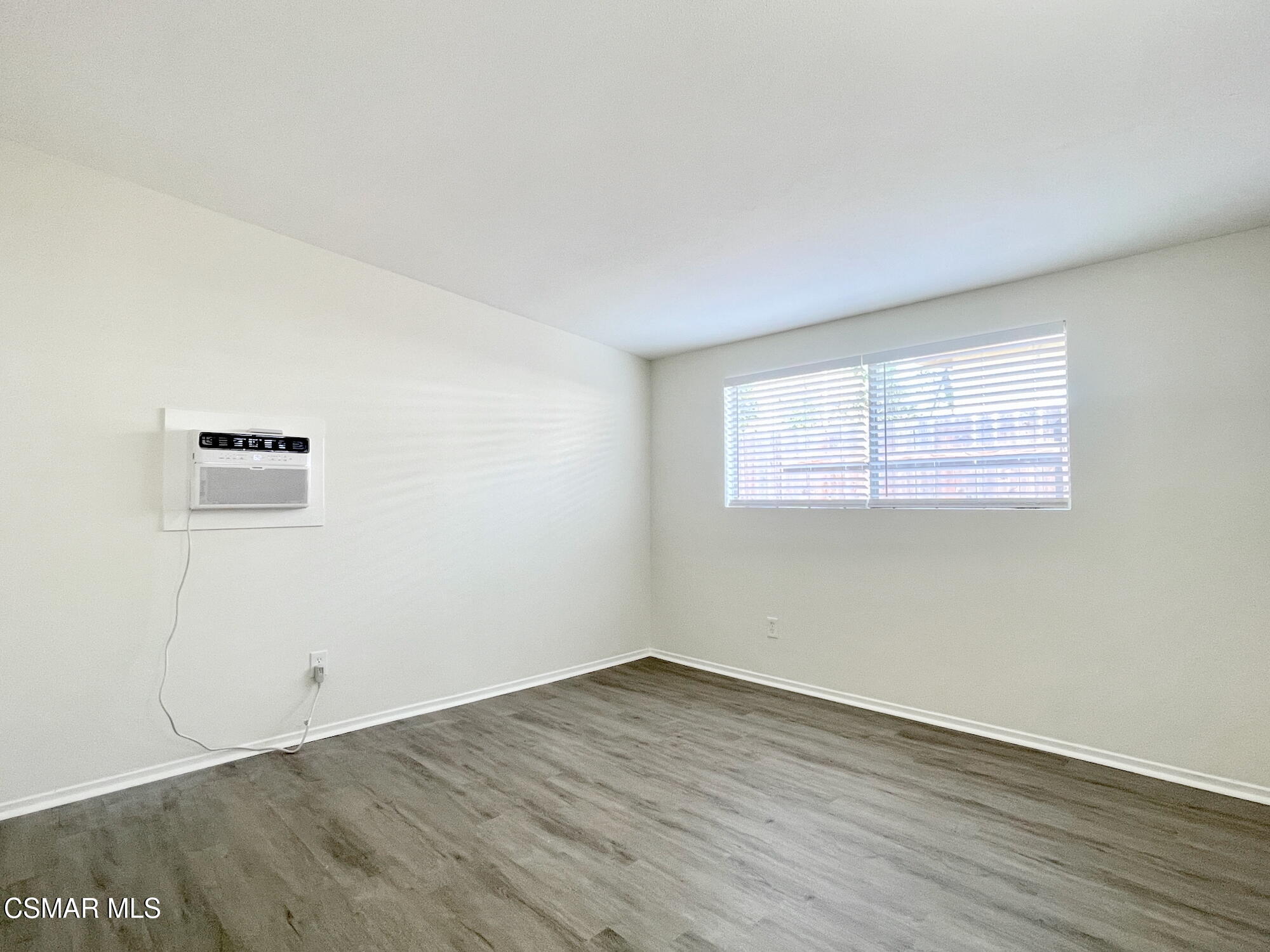 4327 Lou Drive Simi Valley, CA 93063 - Photo 17 of 23 an empty room with wooden floor and windows