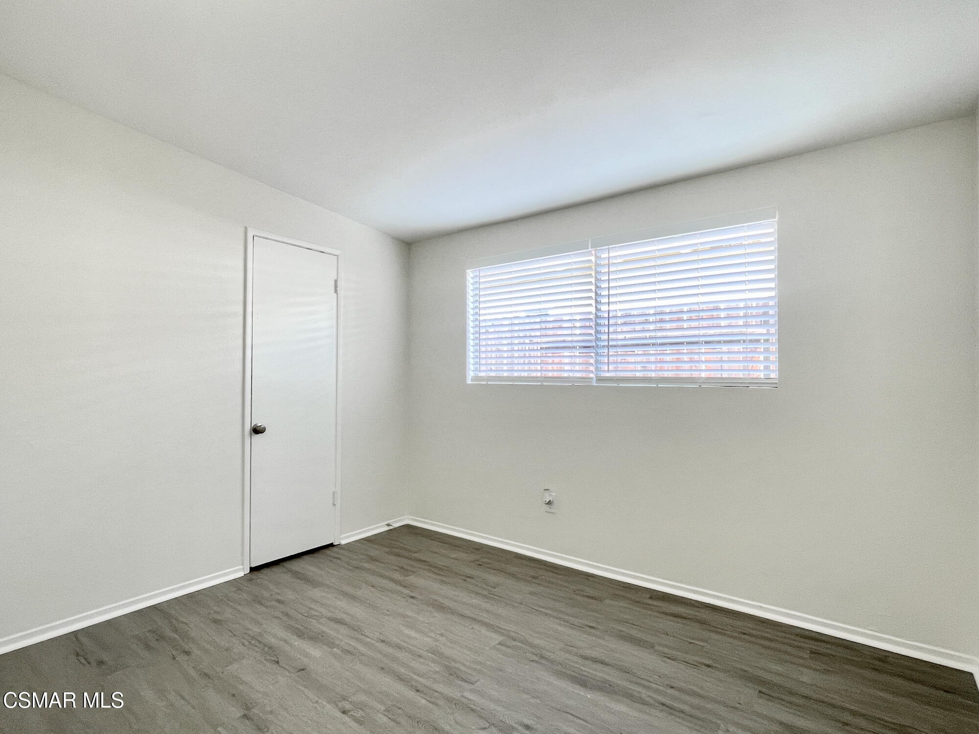 4327 Lou Drive Simi Valley, CA 93063 - Photo 19 of 23 an empty room with wooden floor and windows