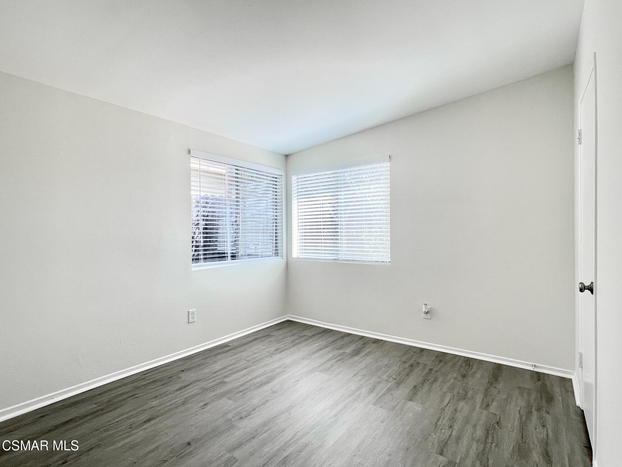 4327 Lou Drive Simi Valley, CA 93063 - Photo 20 of 23 an empty room with wooden floor and windows