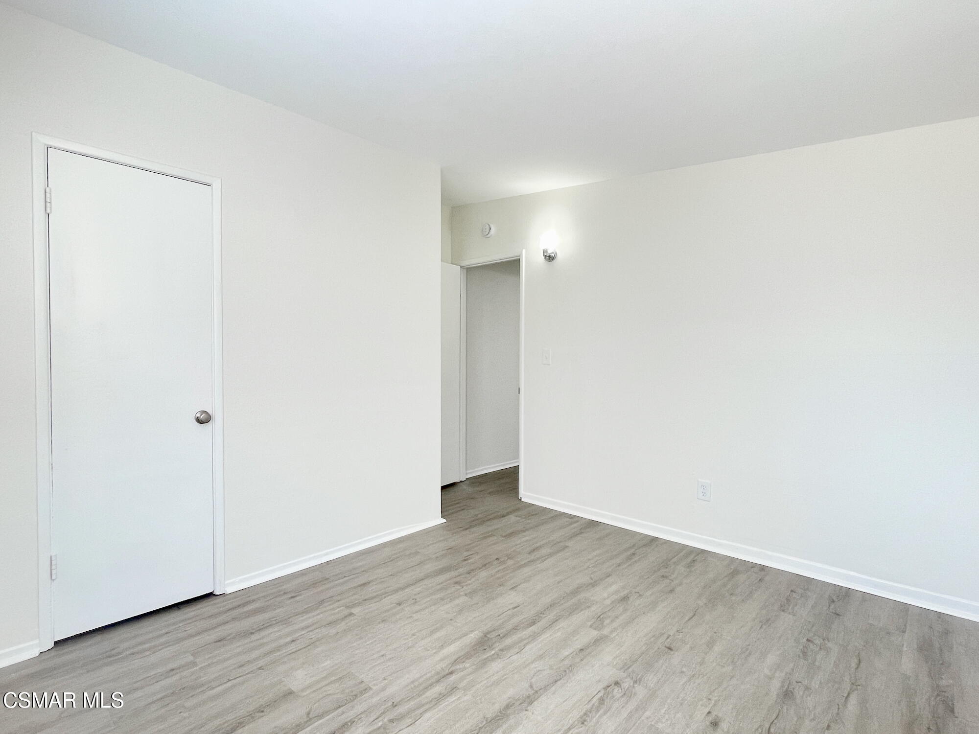 4327 Lou Drive Simi Valley, CA 93063 - Photo 21 of 23 a view of an empty room with wooden floor