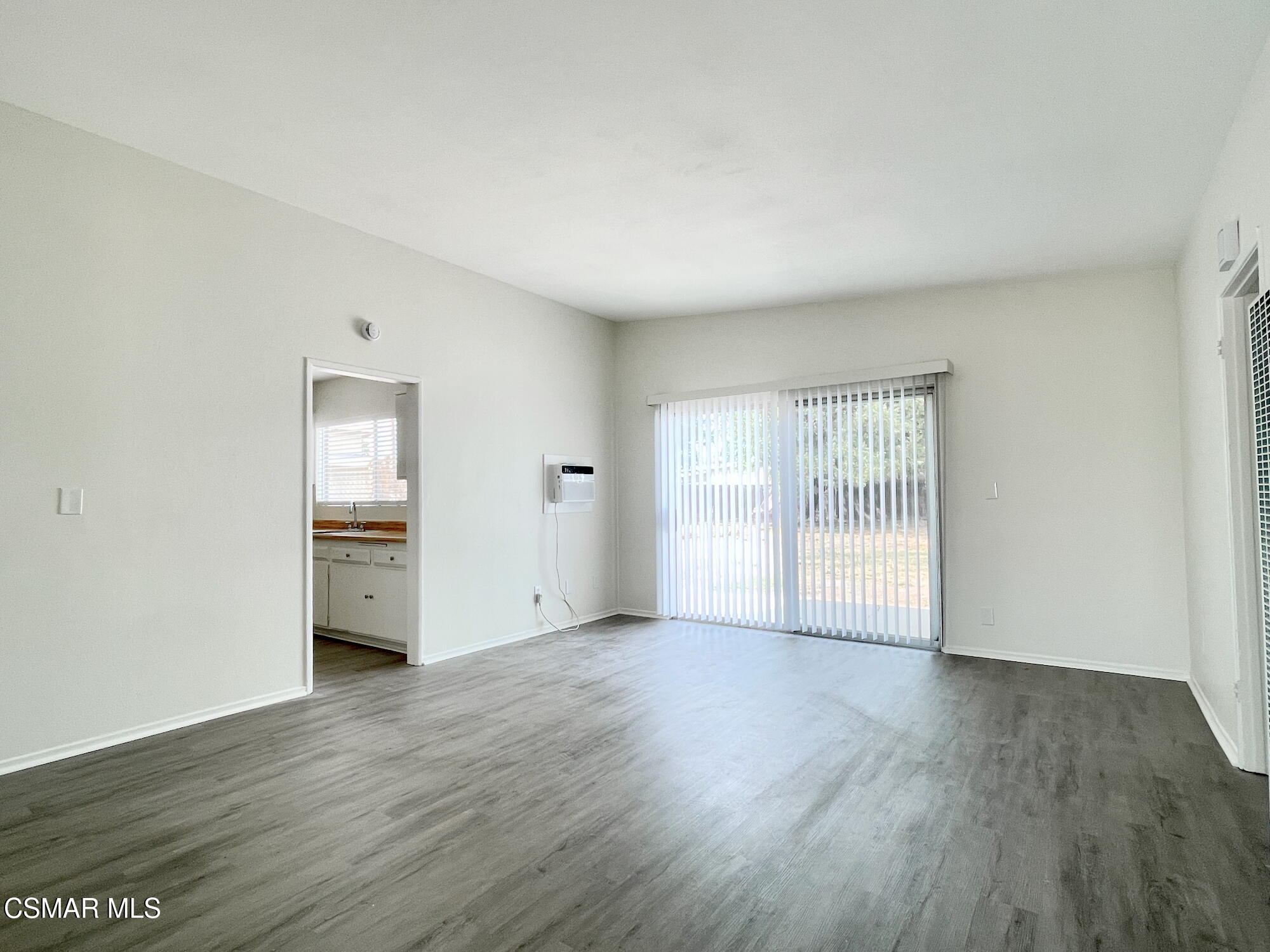 4327 Lou Drive Simi Valley, CA 93063 - Photo 3 of 23 an empty room with wooden floor and windows
