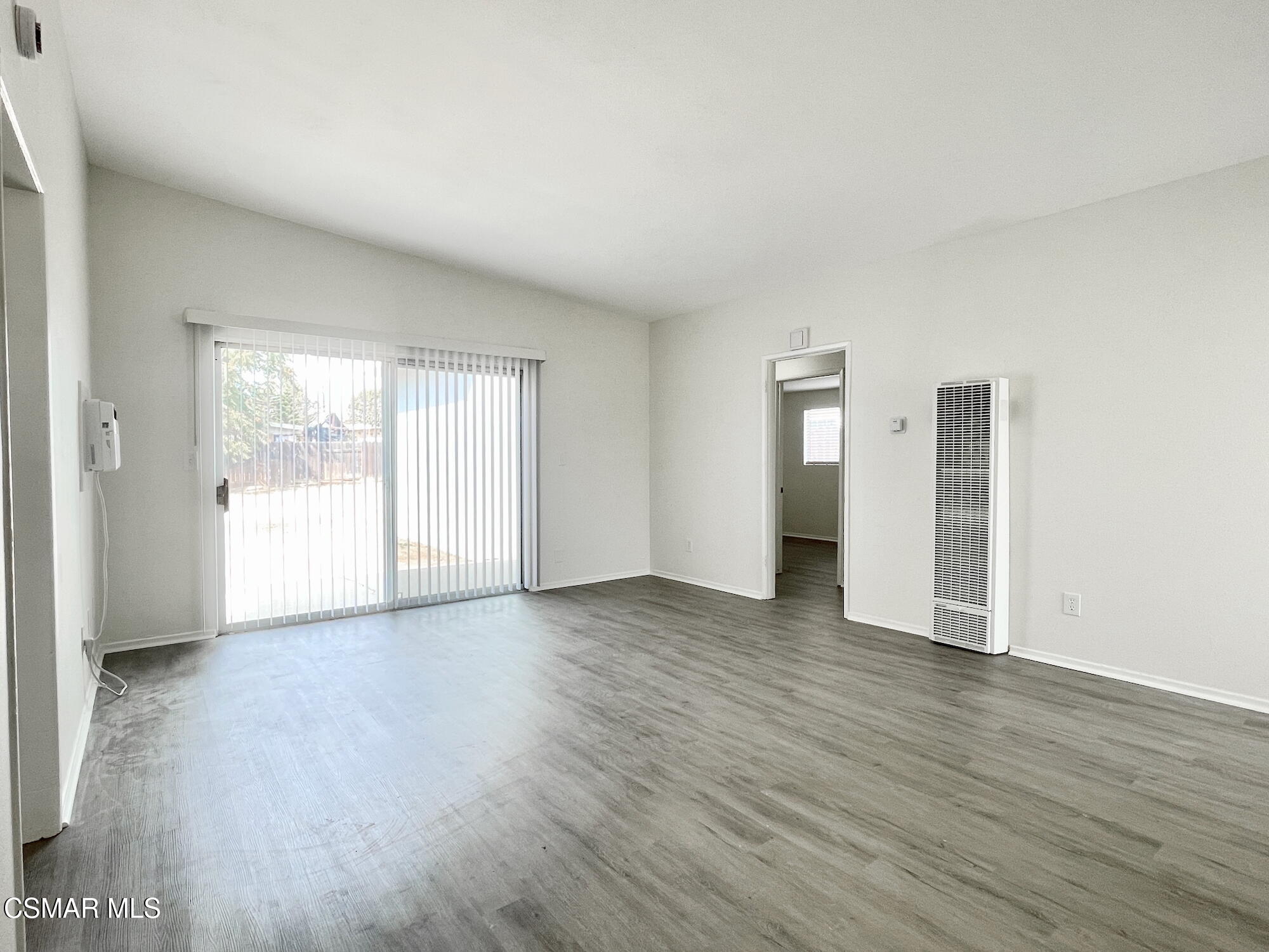 4327 Lou Drive Simi Valley, CA 93063 - Photo 4 of 23 an empty room with wooden floor and windows