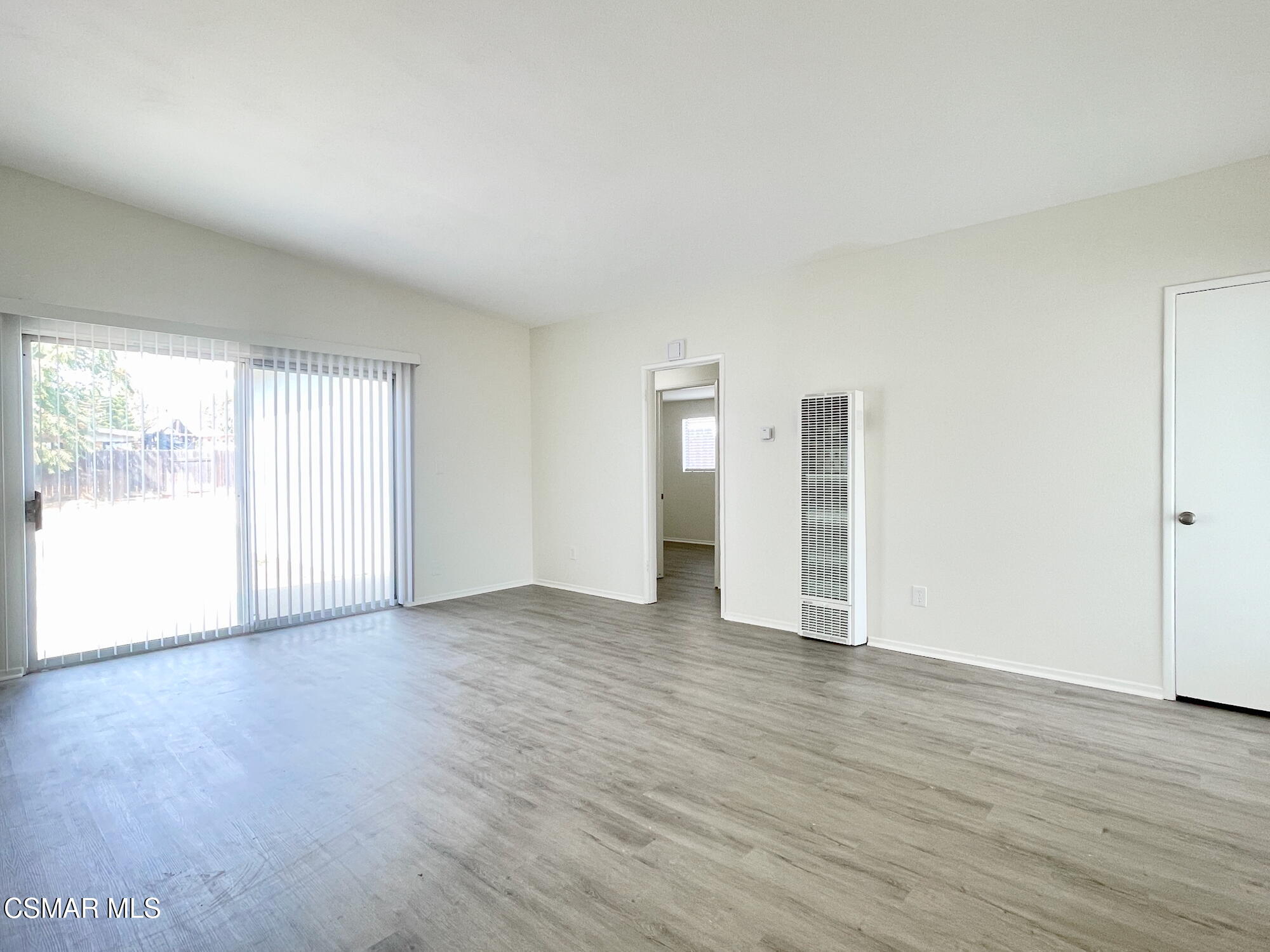 4327 Lou Drive Simi Valley, CA 93063 - Photo 5 of 23 a view of an empty room with wooden floor and a window