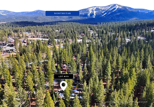 a view of a city with lush green forest