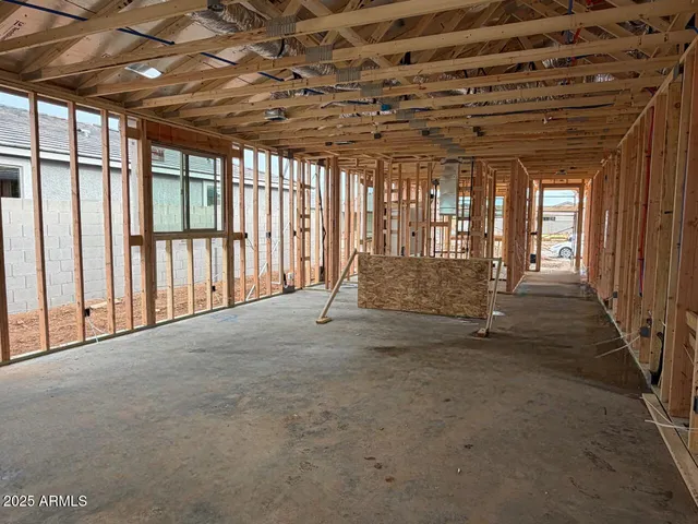 a view of an empty room with a large window