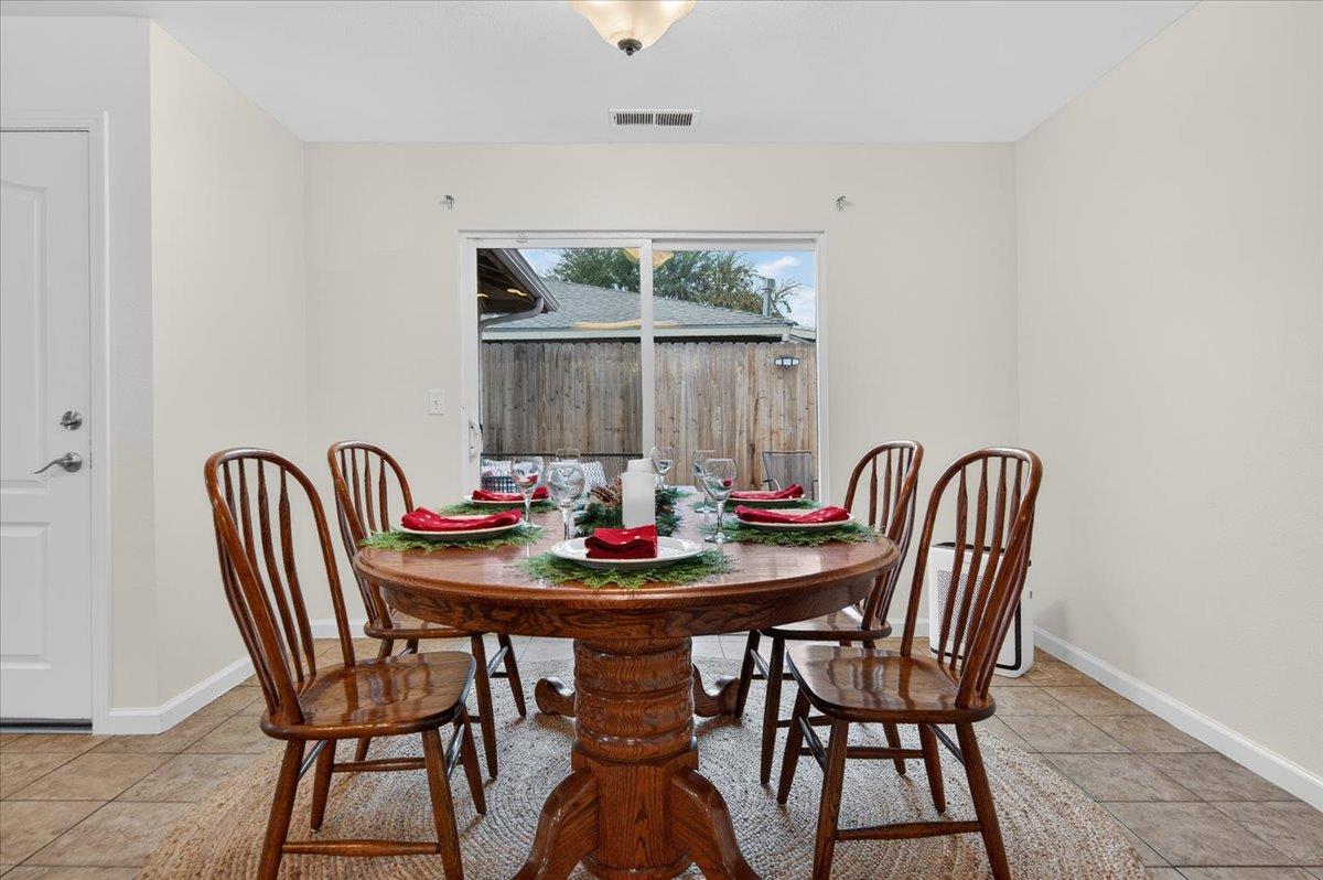 4776 East Rialto Avenue Fresno, CA 93726 - Photo 14 of 54 a view of a dining room with furniture and window