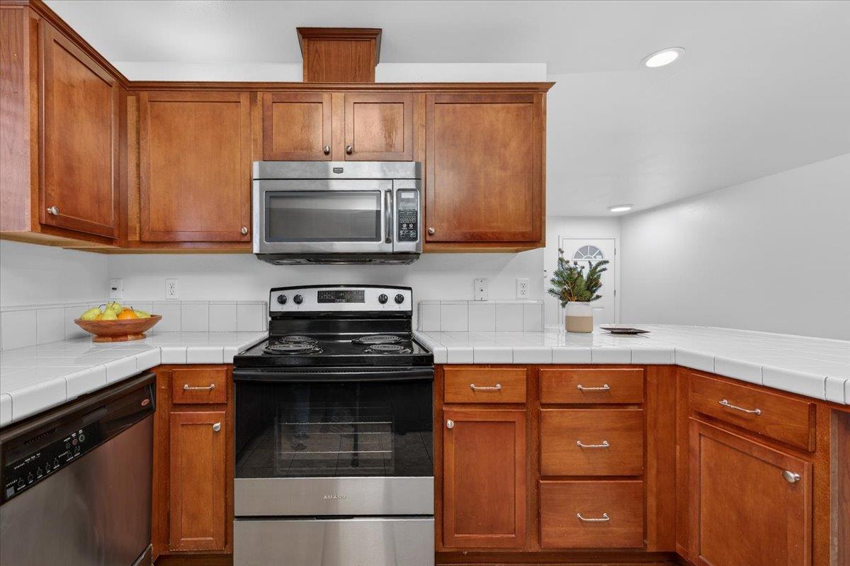 4776 East Rialto Avenue Fresno, CA 93726 - Photo 19 of 54 a kitchen with a sink and a stove top oven