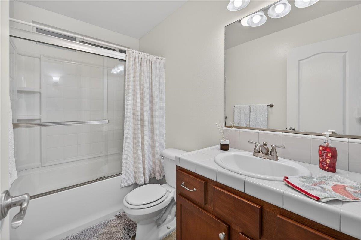 4776 East Rialto Avenue Fresno, CA 93726 - Photo 23 of 54 a bathroom with a sink toilet and shower