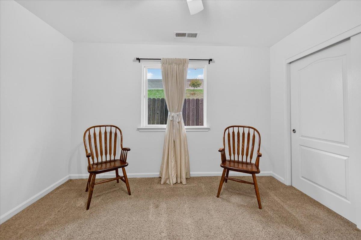 4776 East Rialto Avenue Fresno, CA 93726 - Photo 25 of 54 a living room with furniture and a window