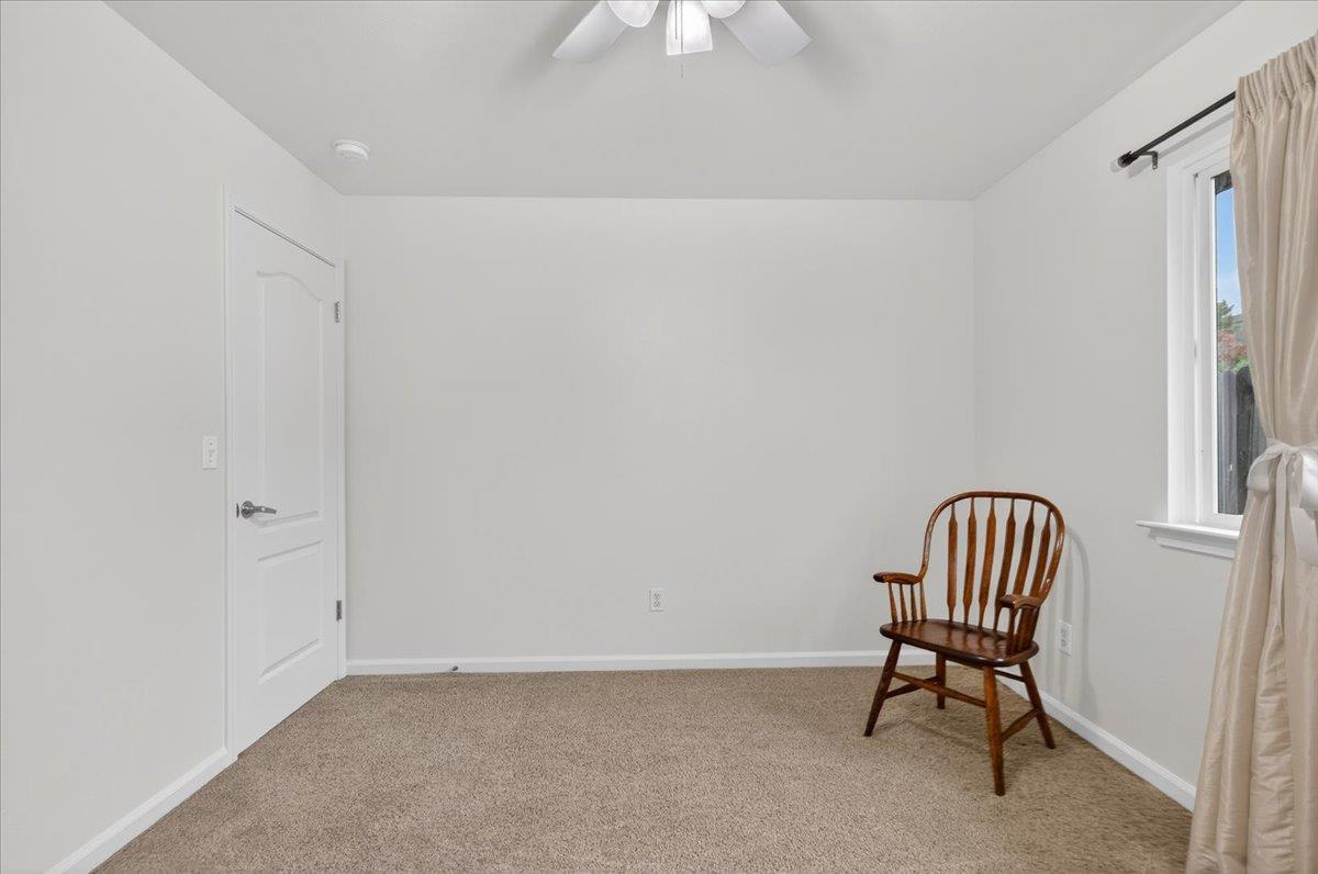 4776 East Rialto Avenue Fresno, CA 93726 - Photo 26 of 54 a room with a chair and a book shelf