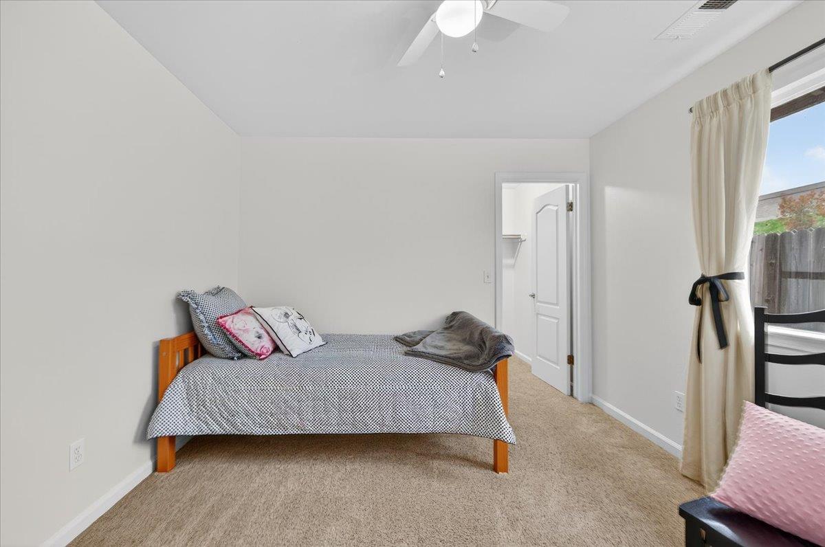 4776 East Rialto Avenue Fresno, CA 93726 - Photo 28 of 54 a bedroom with a bed and a walk in closet