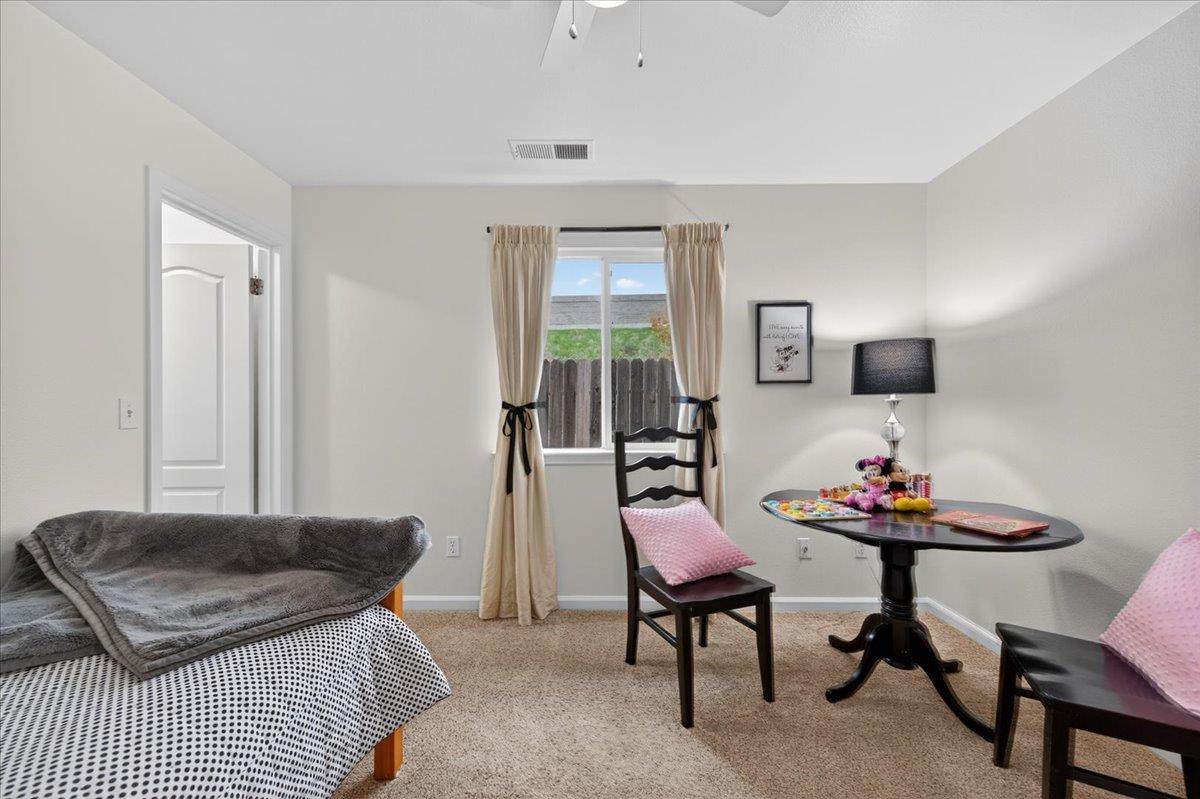 4776 East Rialto Avenue Fresno, CA 93726 - Photo 29 of 54 a living room with furniture and a flat screen tv
