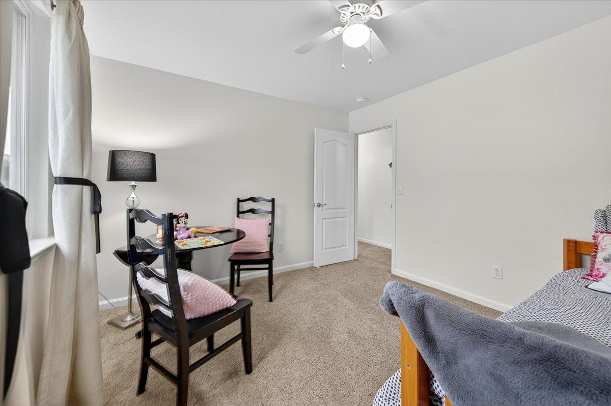 4776 East Rialto Avenue Fresno, CA 93726 - Photo 30 of 54 a living room with furniture and a chandelier