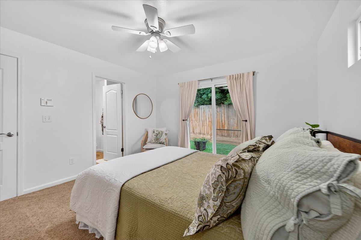 4776 East Rialto Avenue Fresno, CA 93726 - Photo 33 of 54 a bedroom with a bed and a chandelier