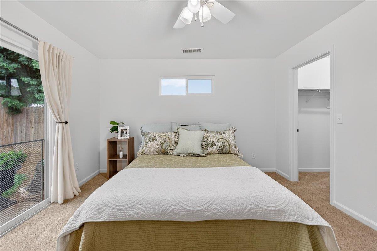 4776 East Rialto Avenue Fresno, CA 93726 - Photo 36 of 54 a bedroom with a bed and a mirror