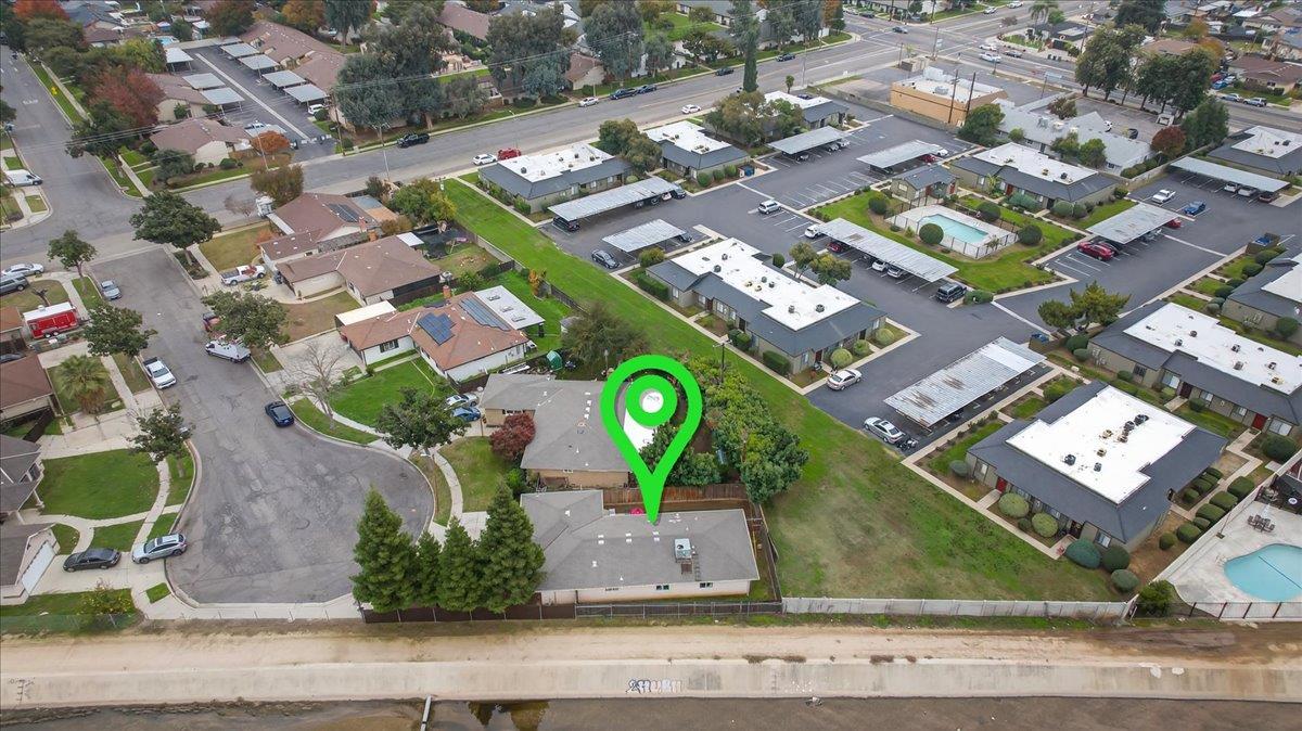 4776 East Rialto Avenue Fresno, CA 93726 - Photo 50 of 54 an aerial view of a residential houses with yard