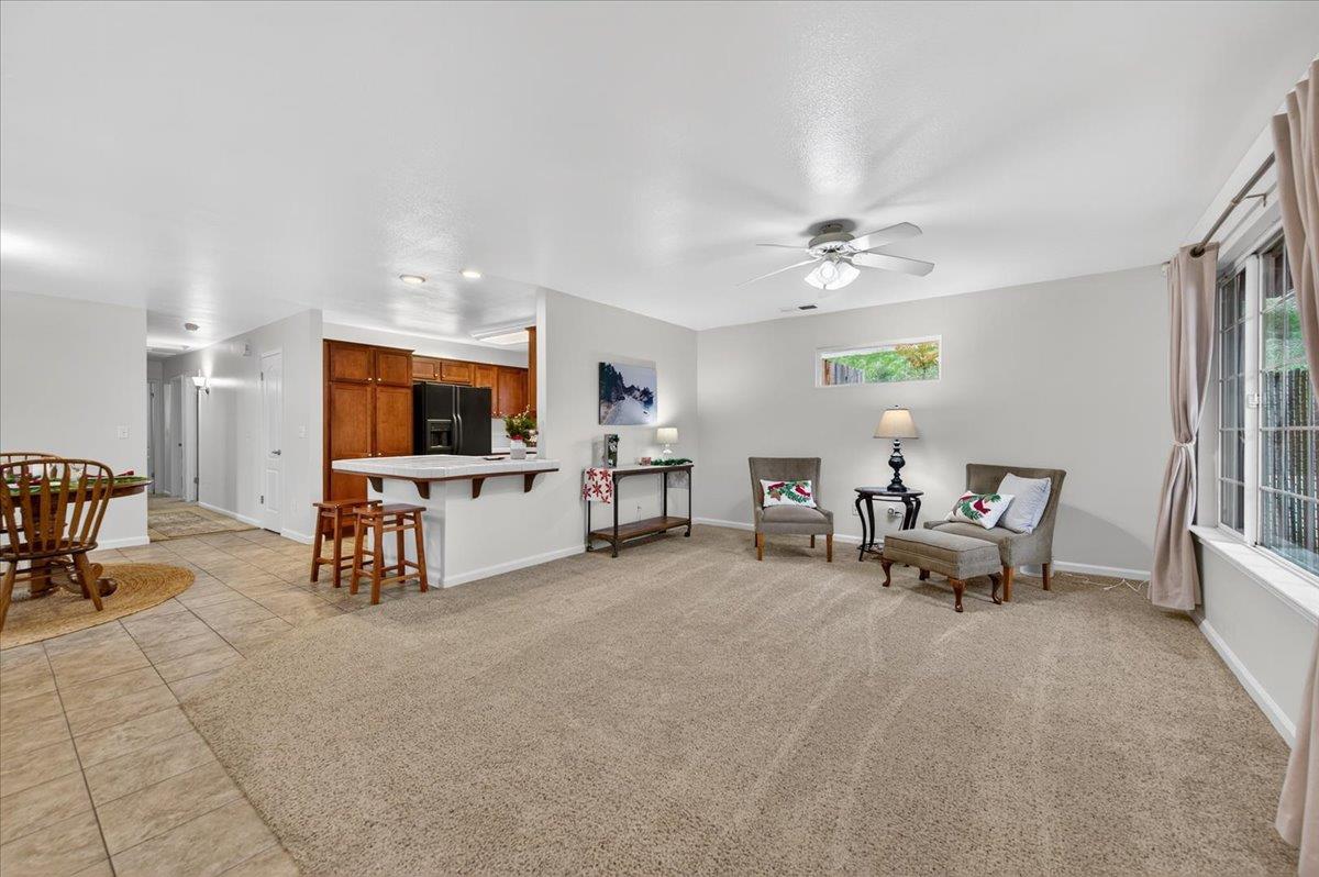 4776 East Rialto Avenue Fresno, CA 93726 - Photo 6 of 54 a living room with furniture and a flat screen tv