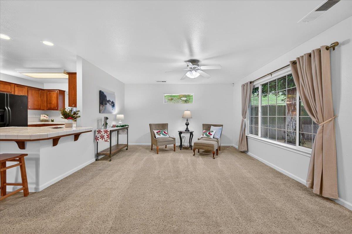 4776 East Rialto Avenue Fresno, CA 93726 - Photo 8 of 54 a view of a workspace with furniture and a kitchen