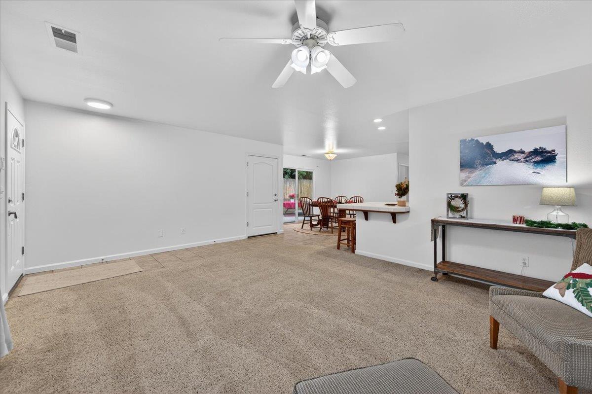 4776 East Rialto Avenue Fresno, CA 93726 - Photo 10 of 54 a view of a livingroom with furniture and a ceiling fan