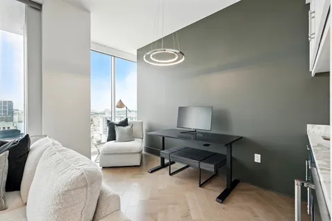 a bedroom with a bed and a chair