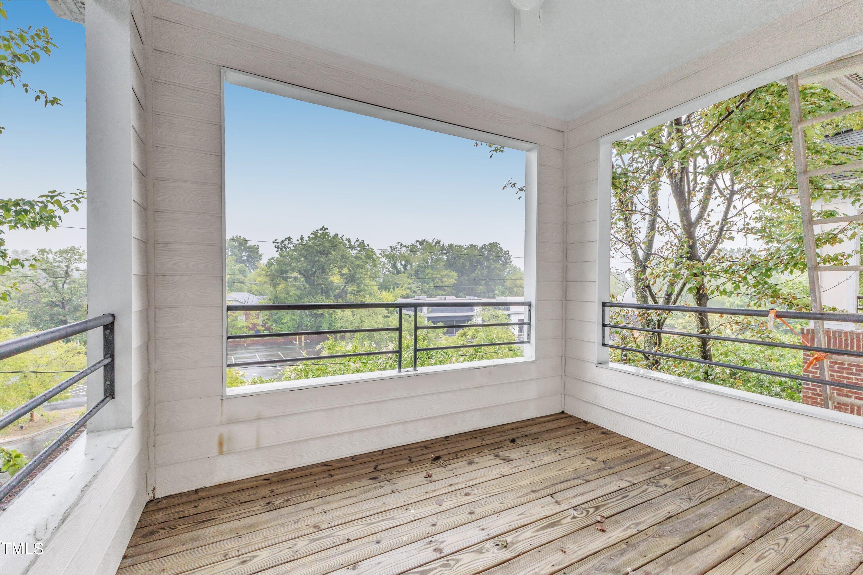 720 North Person Street, Unit 306 Raleigh, NC 27604 - Photo 1 of 13 wooden floor in an empty room with a window